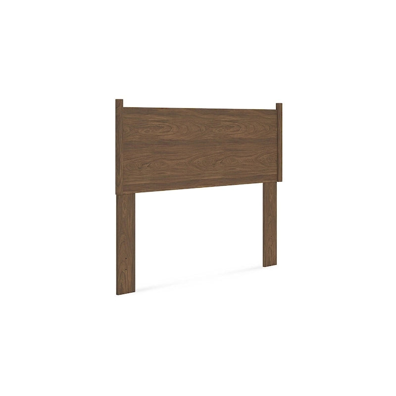 Tête de lit marron, accompagnée d'une coiffeuse et d'une table de chevet.