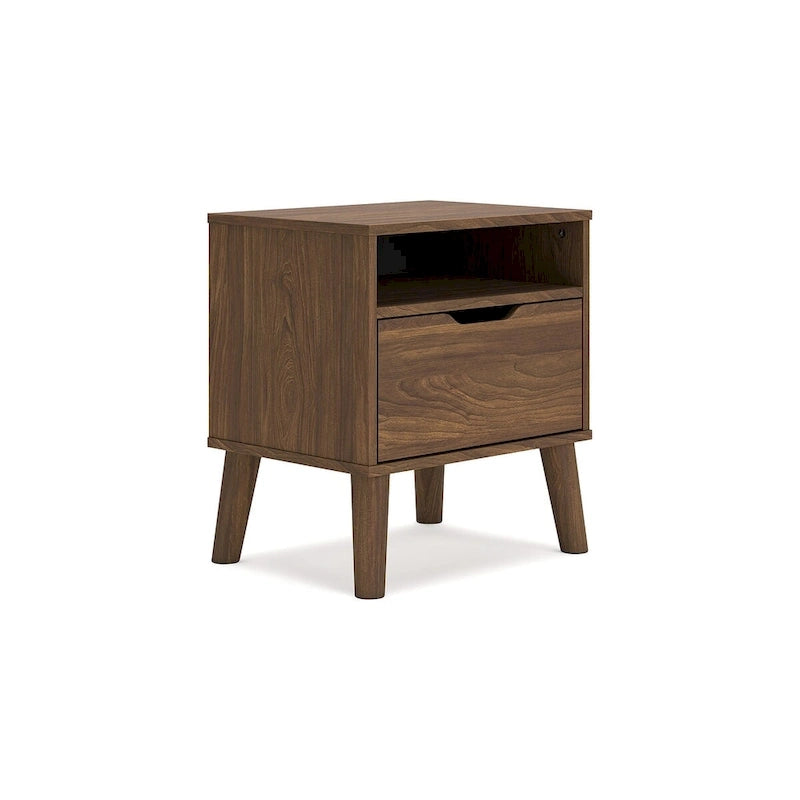 Tête de lit marron, accompagnée d'une coiffeuse et d'une table de chevet.